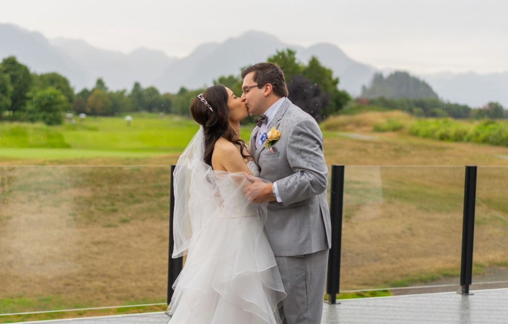 First kiss for bride and groom at Golden Eagle Golf Course