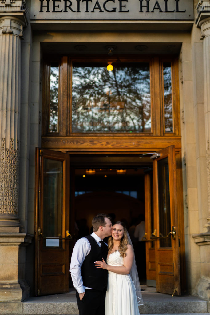 Groom and Bride in front of Heritage Hall on Main Street