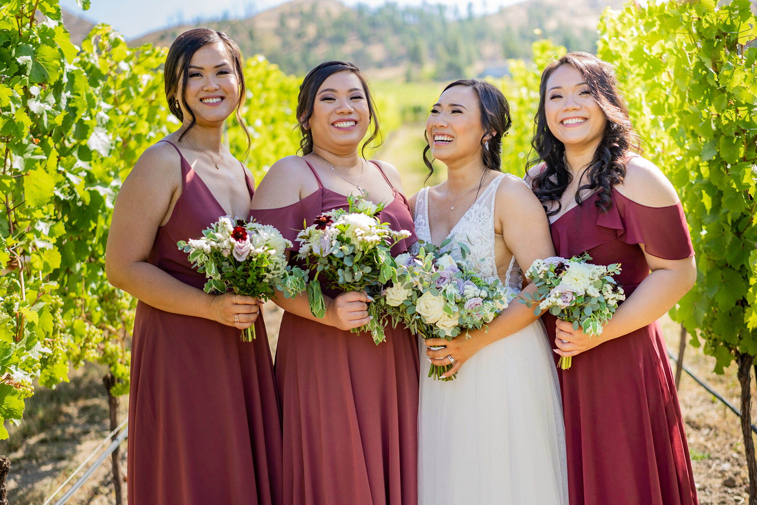 Bridesmaids laughing at Cedarcreek Winery during wedding portraits