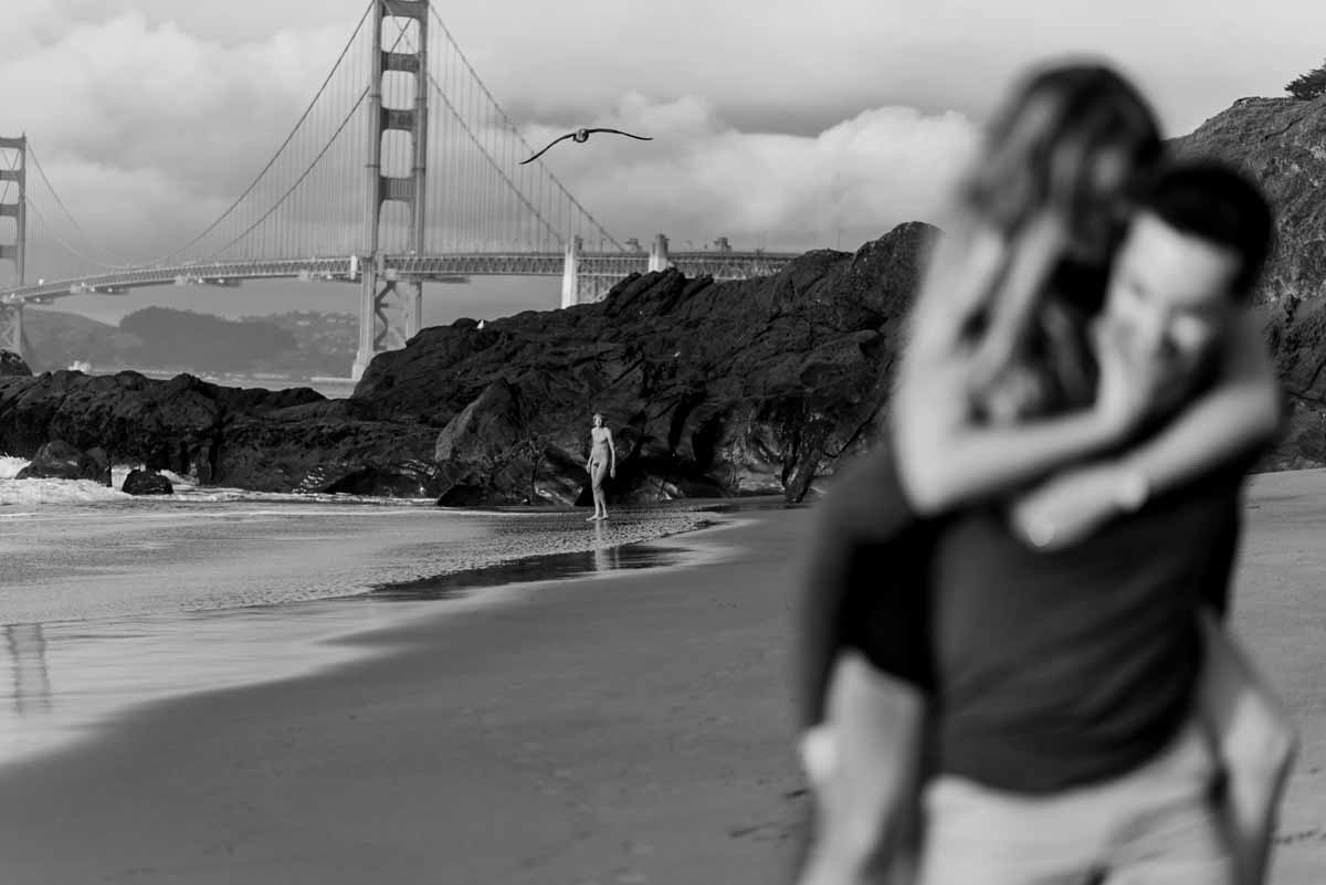 Baker Beach engagement photo with nude person