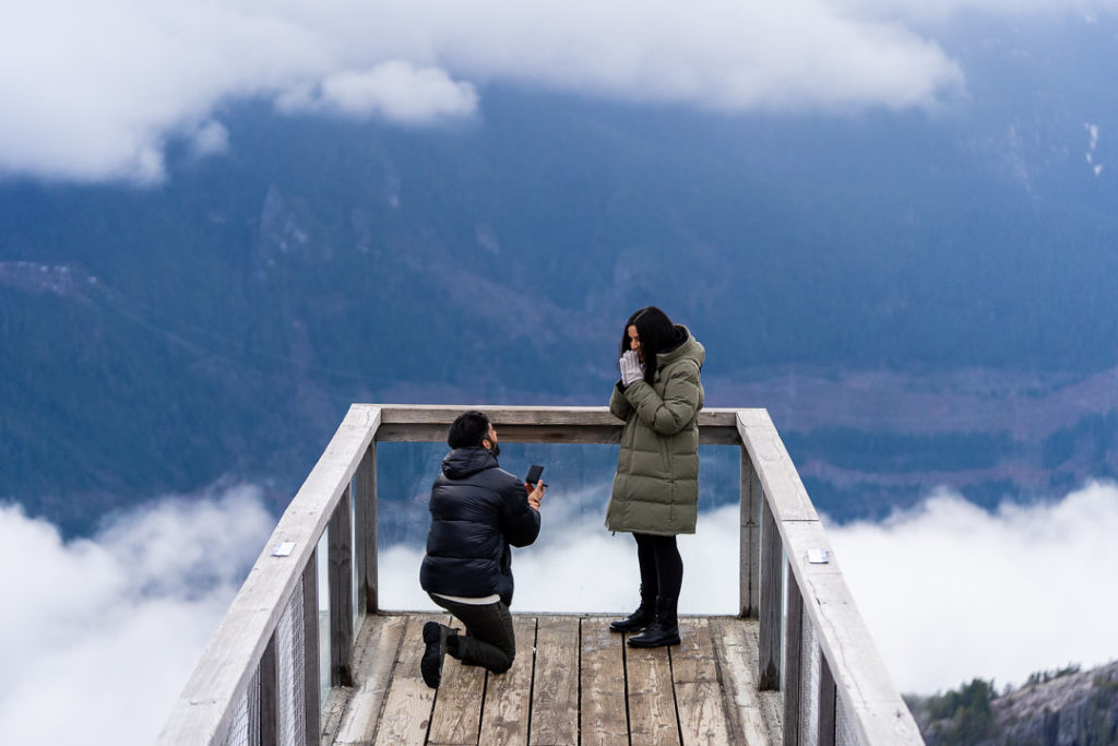 guy proposing to girl at Sea to sky Gondola during winter