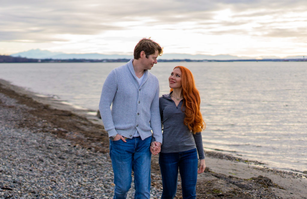 Couple taking their engagement photos on the beach in White Rock