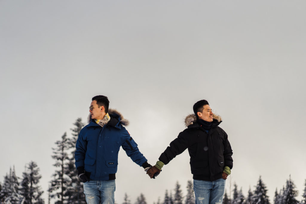 Gay couple holding hands on Grouse Mountain