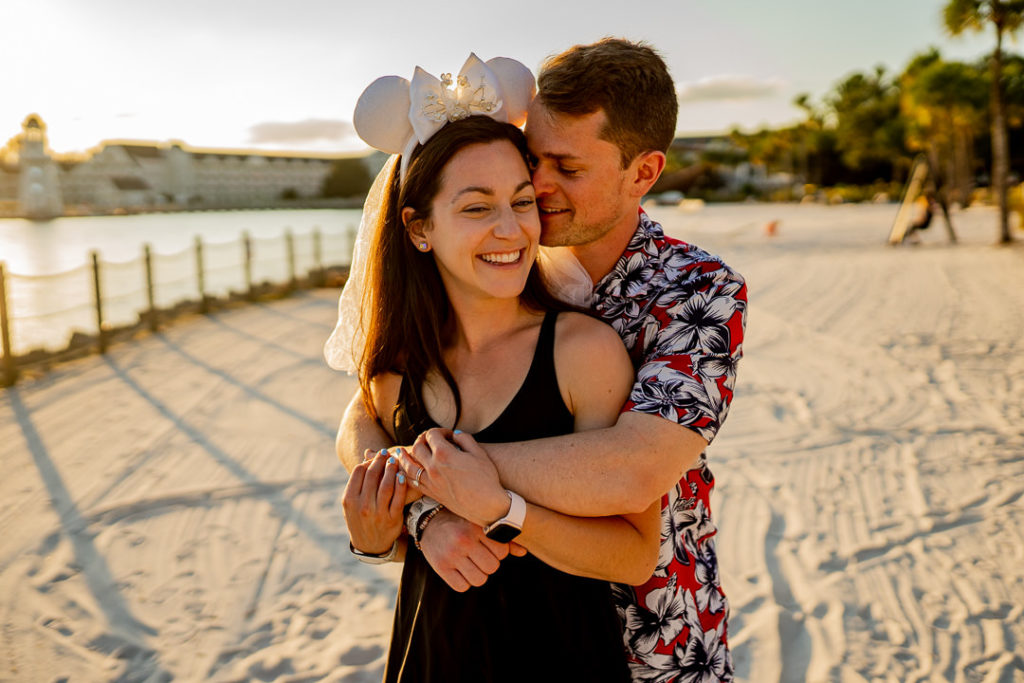 couple hugging during their Disney World Boardwalk engagement session