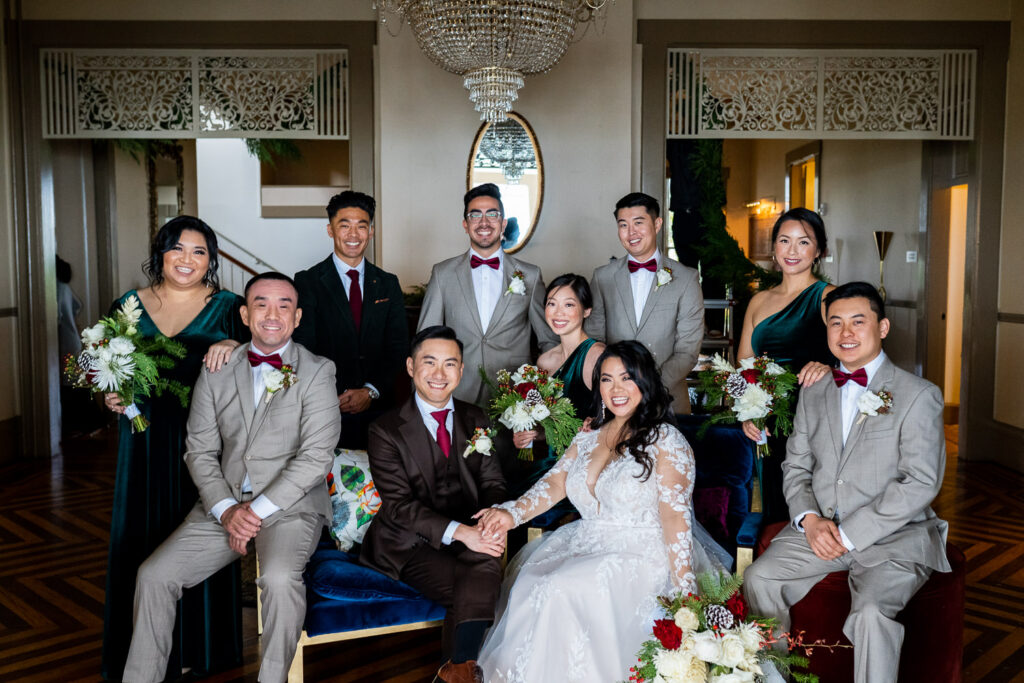 bridal party sitting at The General's Residence at Fort Mason