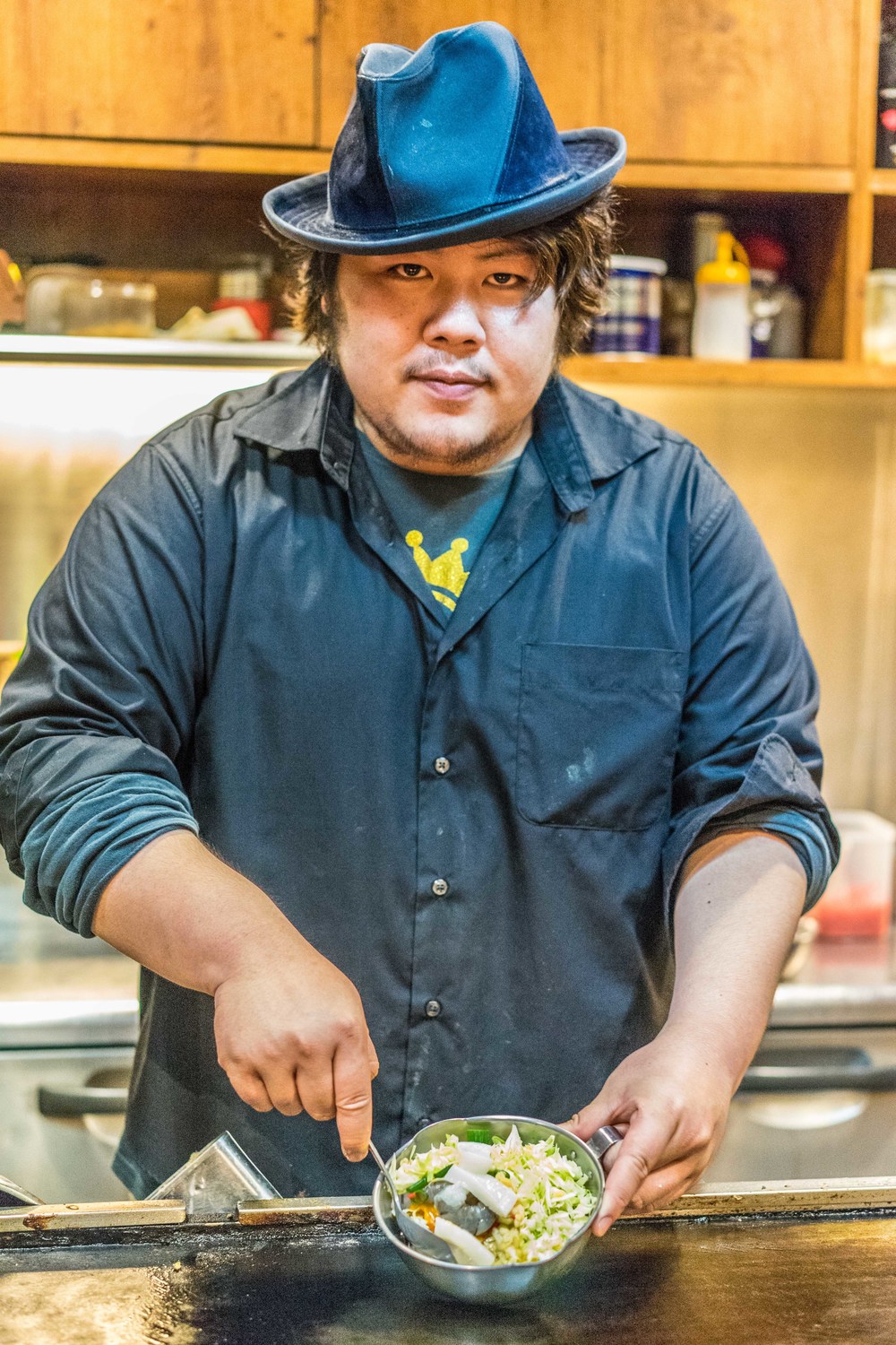 The owner/ chef who prepared the okonomiyaki before bringing it to the table for us. 