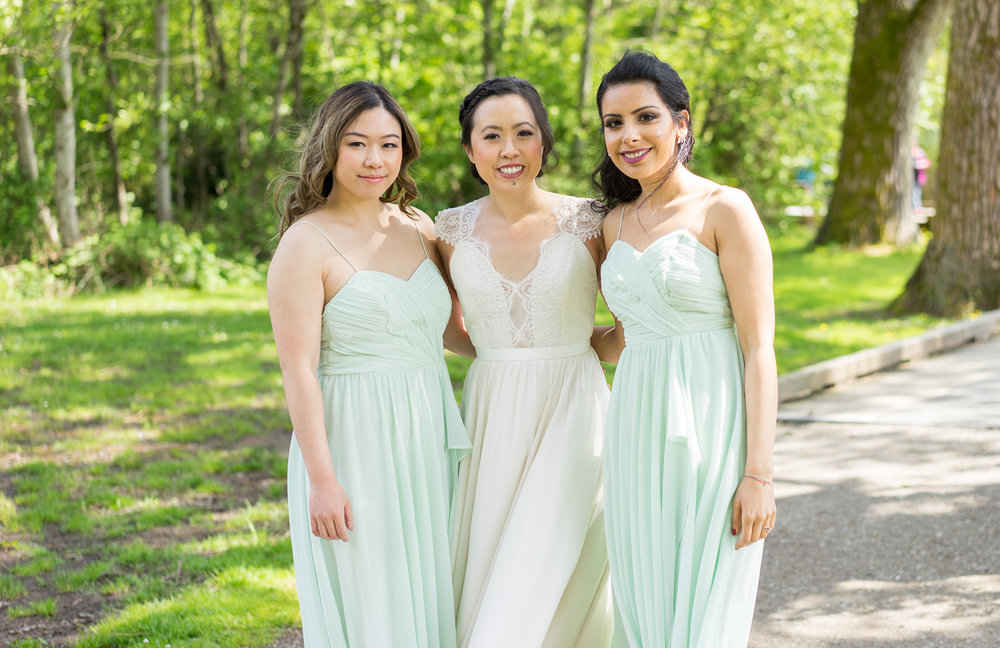 Bride and her bridesmaid at Deer Lake for their spring wedding