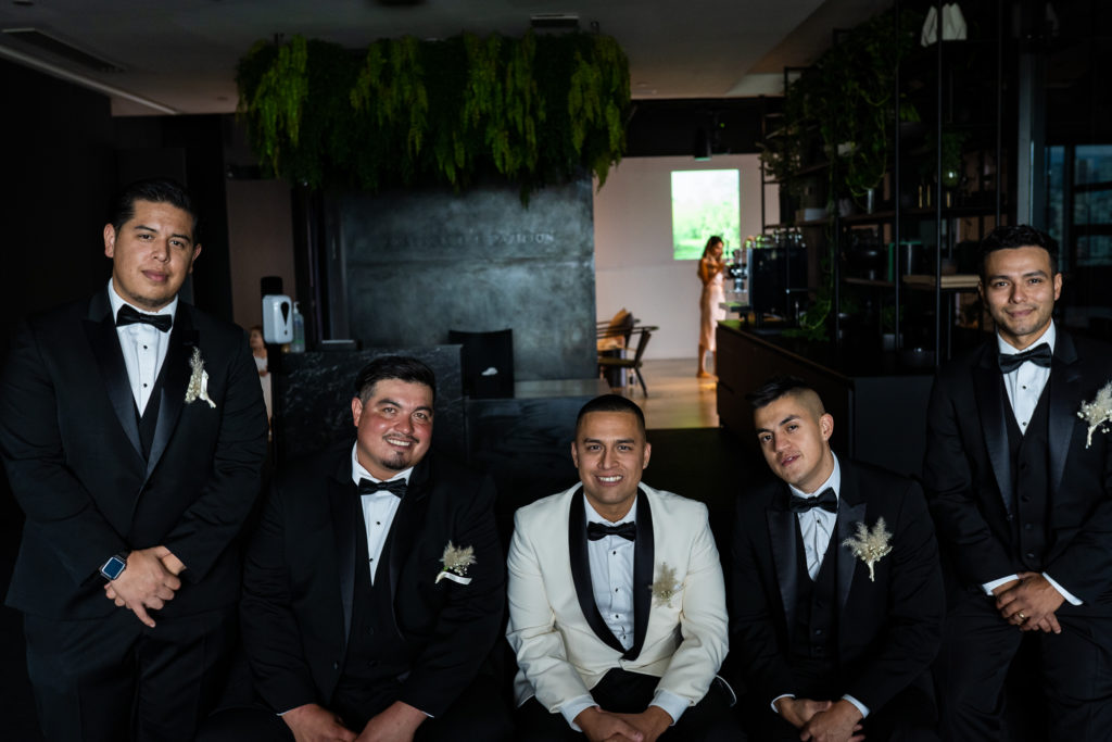 groomsmen sitting at The Gallery by Pavilion