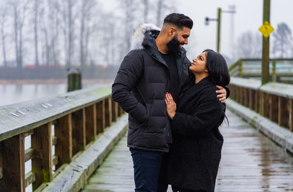 Riverfront Engagement Photos in the rain