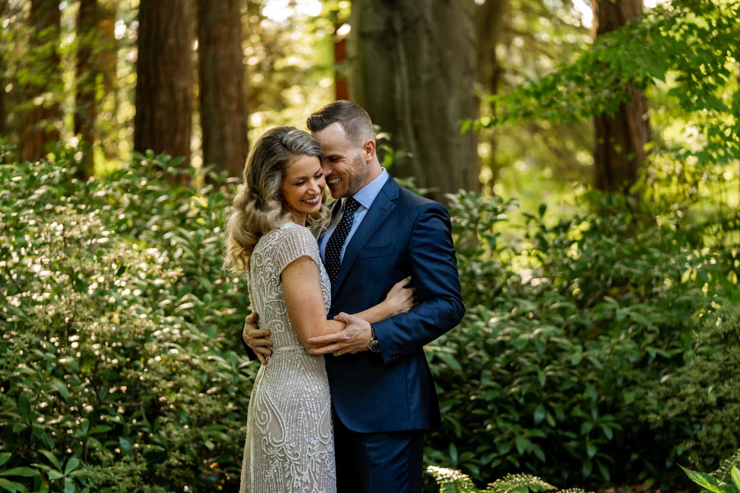 couple hugging at Stanley Park right after their elopement