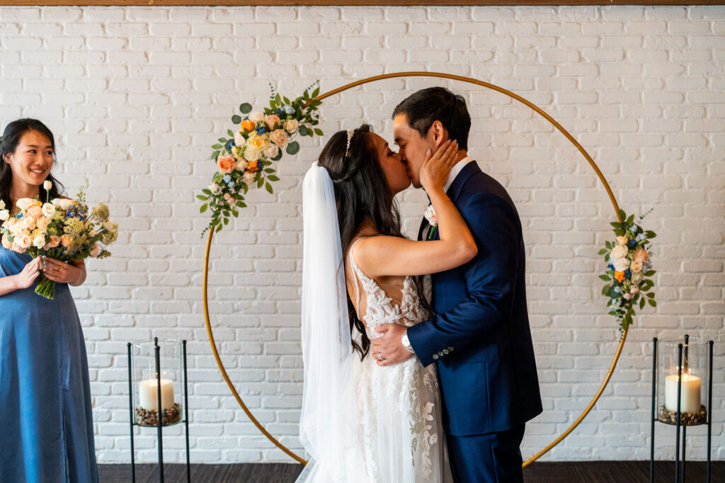 bride and groom kissing during ceremony at The Loft at Earls Yaletown Wedding